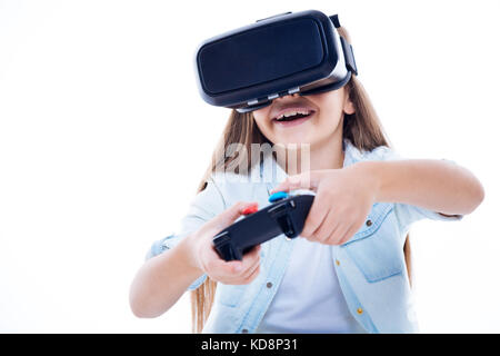 Happy excited girl using game console Stock Photo