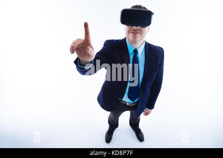 Cheerful positive businessman using modern technology Stock Photo