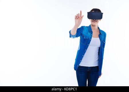 Attractive cheerful woman using 3d technologies Stock Photo