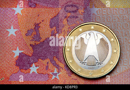 German Euro coin on a 10 Euro note Stock Photo