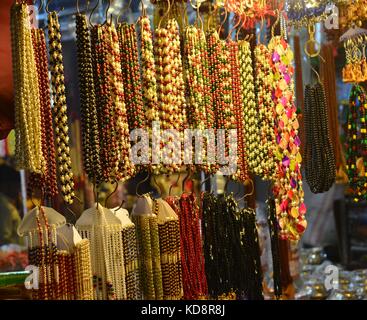 The image was captured in local market of Haridwar in Uttarakhand in India. It depicts the ornaments put up for sale in a local shop. Stock Photo