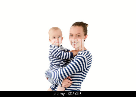 Mom is holding a son in vests on a white background Stock Photo