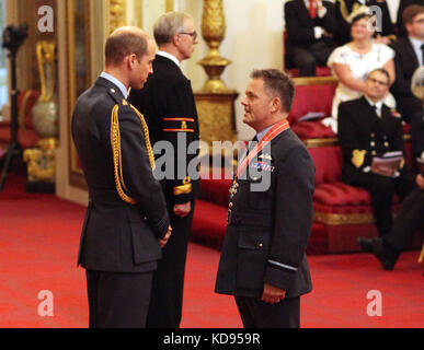 Air Commodore Martin&Ecirc;Sampson, Royal Air Force, from Banchory is made a CBE (Commander of the Order of the British Empire) by the Duke of Cambridge during an Investiture ceremony at Buckingham Palace, London. Stock Photo