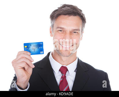 Close-up Of A Smiling Mature Businessman Holding Credit Card Stock Photo