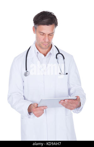 Portrait Of Happy Mature Male Doctor Holding Digital Tablet Stock Photo