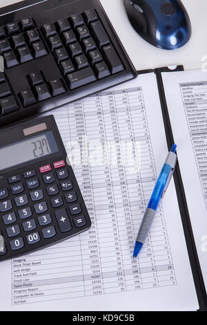 Financial papers calculator and pen. Isolated on white Stock Photo