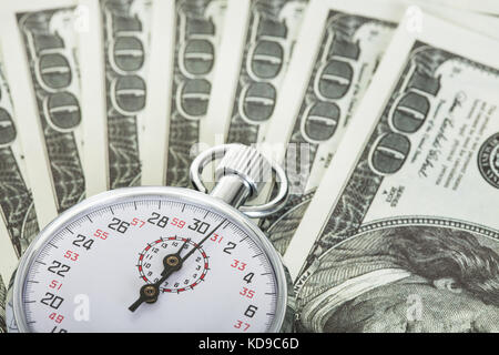 Stopwatch and dollars. Time is money concept Stock Photo