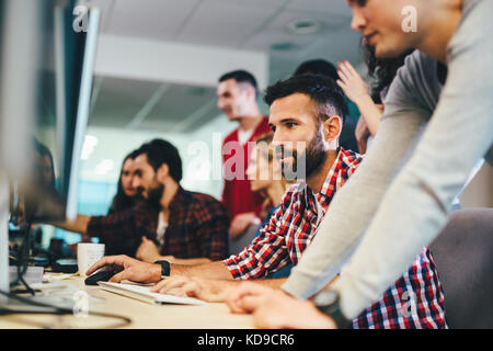Portrait of programmers working in development software company Stock Photo