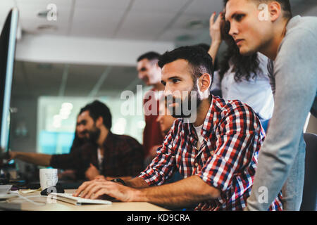 Portrait of programmers working in development software company Stock Photo