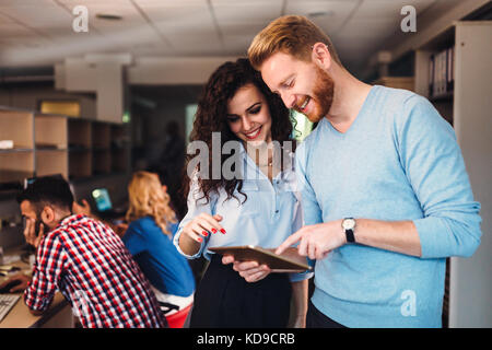 Portrait of software engineers using digital tablet Stock Photo