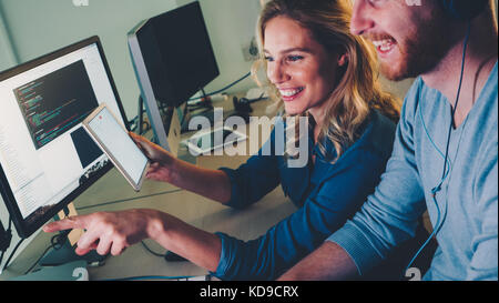 Software engineers working on project and programming in company Stock Photo