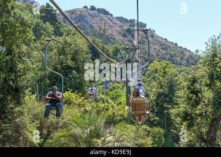 ANACAPRI, ISLE OF CAPRI, ITALY - AUGUST 2019: Visitors on a chair lift  travelling to the summit of Mount Solaro above Anacapri Stock Photo - Alamy