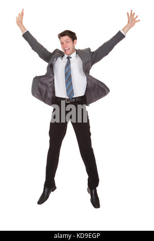 Portrait Of Happy Young Excited Businessman Over White Background Stock Photo