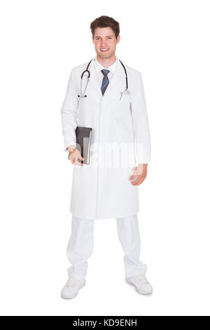 Male Doctor Holding Folder With Medical Reports Stock Photo