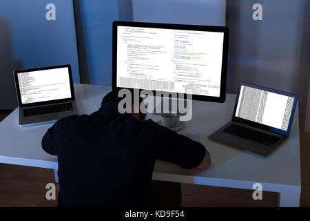 Programmer sleeping at working place in the office Stock Photo