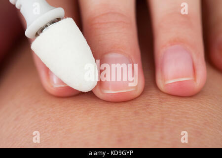 Close-up Photo Of A Hand Manicuring Nails Stock Photo