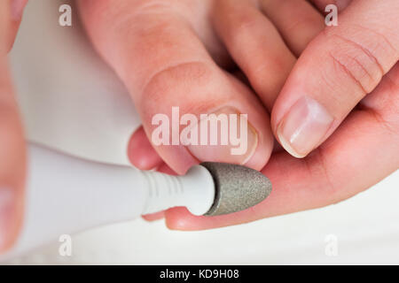 Close-up Photo Of A Hand Manicuring Nails Stock Photo