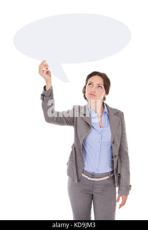 Serious Businesswoman Looking At Speech Bubble Over White Background Stock Photo