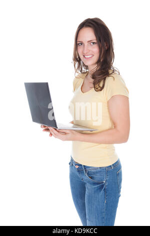 Girl with laptop over white background Stock Photo - Alamy