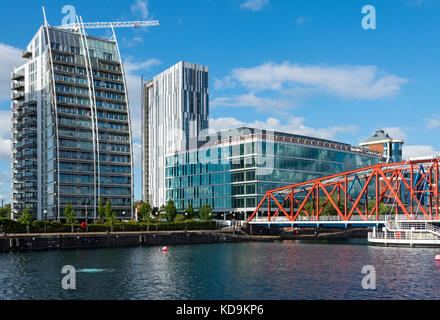 The NV apartments, X1 MediaCity apartments and the Regent office buildings. over Huron Basin, Salford Quays, Manchester, UK. Stock Photo