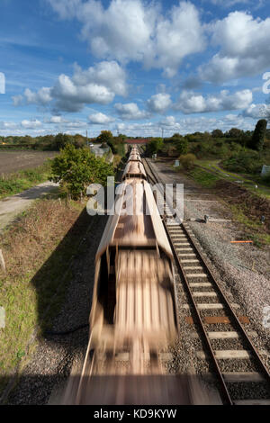 DB Cargo Mendip rail Merehead Quarry - Theale aggregates train passing  Woodborough (between Pewsey & Westbury)  on the Berks and Hants line Stock Photo