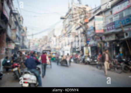 Blurred photo of everyday life in the crowded streets of New Delhi in India. Stock Photo