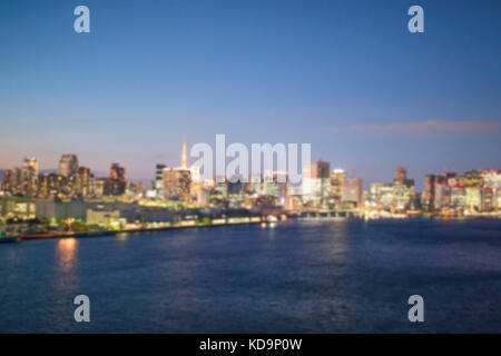 Blurred photo of Tokyo skyline at night. Photo taken on The Rainbow bridge in Tokyo, Japan. Stock Photo