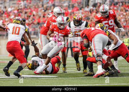 Ohio Stadium, Columbus, OH, USA. 7th Oct, 2017. Ohio State Buckeyes running back Mike Weber (25) runs the ball in traffic during an NCAA football game between the Ohio State Buckeyes and the Maryland Terrapins at Ohio Stadium, Columbus, OH. Adam Lacy/CSM/Alamy Live News Stock Photo