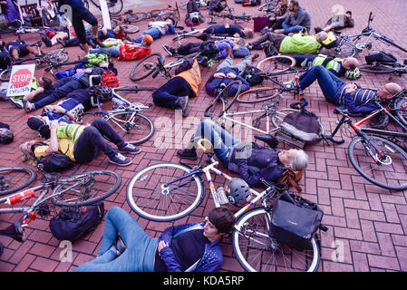 London, UK. 12 October 2017.  Stop Killing Cyclists campaign group stage a die-in outside Kensington and Chelsea Town Hall after a female cyclist was killed on Chelsea Bridge on September 27th, the seventh rider to die in a road accident in 2017. Credit: Stephen Chung / Alamy Live News Stock Photo