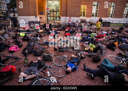 London, UK. 12th Oct, 2017. Activists from the Stop Killing Cyclists campaign hold a die-in and vigil outside Kensington and Chelsea town hall to mark the death of 36-year-old cyclist Charlotte Landi on 27th September after being struck by an HGV on Chelsea Bridge. The London Borough of Kensington and Chelsea has been criticised by cycle campaigners for blocking protected cycle highways and refusing to implement 20mph speed limits. Credit: Mark Kerrison/Alamy Live News Stock Photo