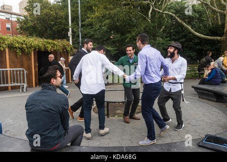 New York, NY 12 October 2017 - Jewish men celebrate the end of Sukkot with dancing in Washington Square Park CREDIT Credit: Stacy Walsh Rosenstock/Alamy Live News Stock Photo