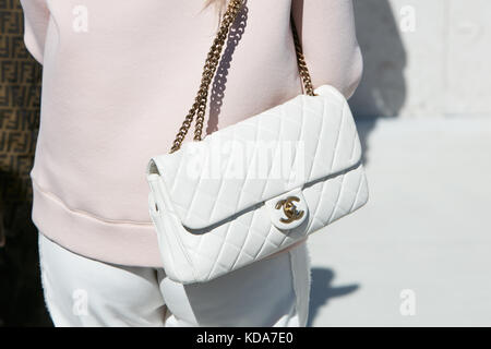 MILAN - SEPTEMBER 20: Woman with pale pink Chanel bag and black and white  striped trousers before Alberto Zambelli fashion show, Milan Fashion Week  st Stock Photo - Alamy