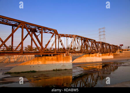 Train trestle bridge over Los Angeles River, South Gate, Los Angeles County, California, USA Stock Photo