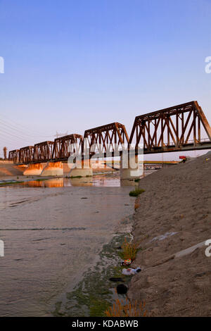 Train trestle bridge over Los Angeles River, South Gate, Los Angeles County, California, USA Stock Photo