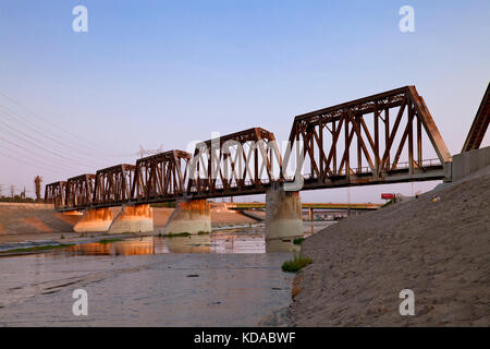 Train trestle bridge over Los Angeles River, South Gate, Los Angeles County, California, USA Stock Photo