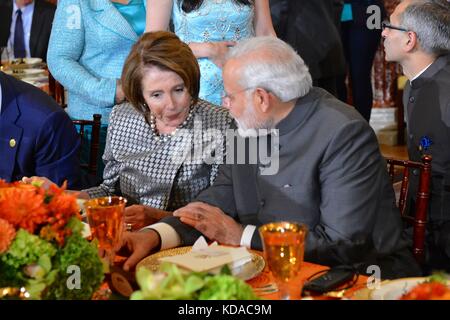U.S. House of Representatives Minority Leader Nancy Pelosi talks to Indian Prime Minister Narendra Modi during a luncheon at the U.S. Department of State September 30, 2014 in Washington, DC. Stock Photo