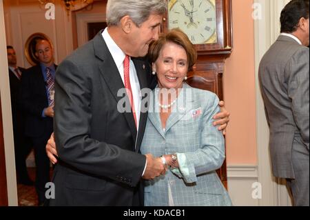 U.S. Secretary of State John Kerry greets U.S. House of Representatives Minority Leader Nancy Pelosi during a reception celebrating the groundbreaking for the Milan Expo 2015 USA Pavilion at the U.S. Department of State  July 16, 2014 in Washington, DC. Stock Photo