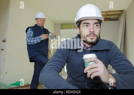 worker on a break drinking coffee and having a rest Stock Photo