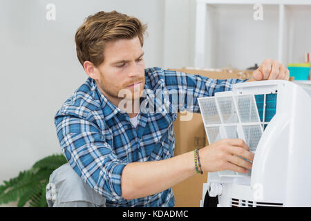 repairman fixing electronic devices Stock Photo