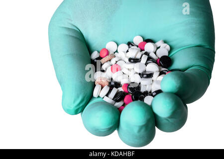 handful of pills in hand Stock Photo