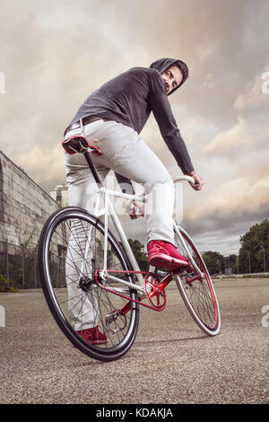 Man on a modern single speed bicycle Stock Photo