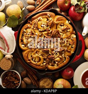 Cinnamon rolls with apples, caramel and pecan