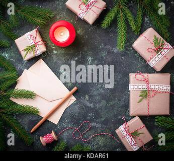 Christmas background. Gift boxes, letter and candle Stock Photo