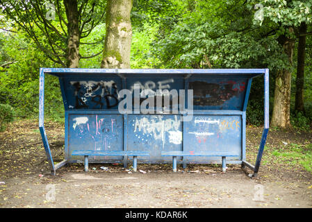 A graffiti covered park bench in the Greater Manchester town of Tyldesley Stock Photo