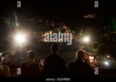 Night time candlelit procession at Lourdes, France Stock Photo