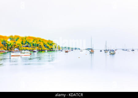 Empty marina harbor in small village in Maine during rain with boats in autumn Stock Photo