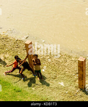 Street kids playing on the banks of the Yamuna River in Agra, India Stock Photo