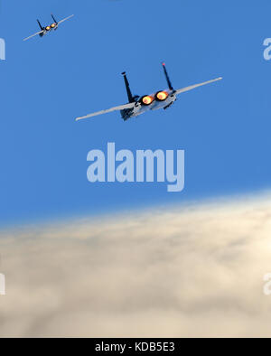 Two jerfighters flying at high speed above the clouds Stock Photo