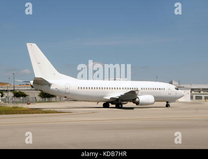 Unmarked white passenger jet airplane side view Stock Photo
