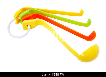 Colorful assortment of plastic measuring spoons. Isolated. Stock Photo
